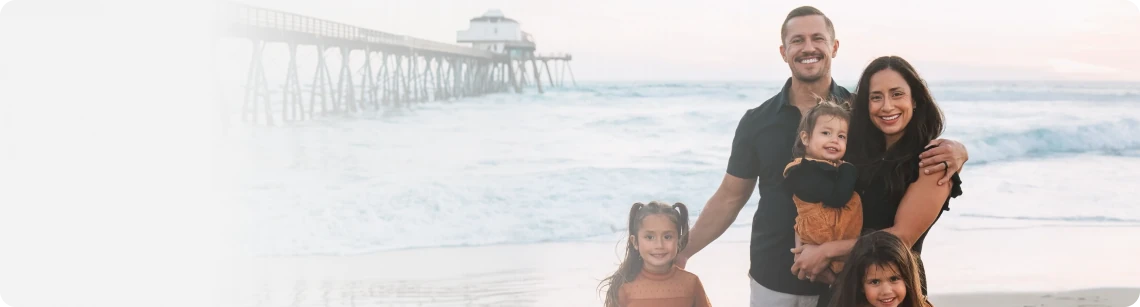 Dr. Michael VanDerschelden, DC with his family on the beach in Huntington Beach