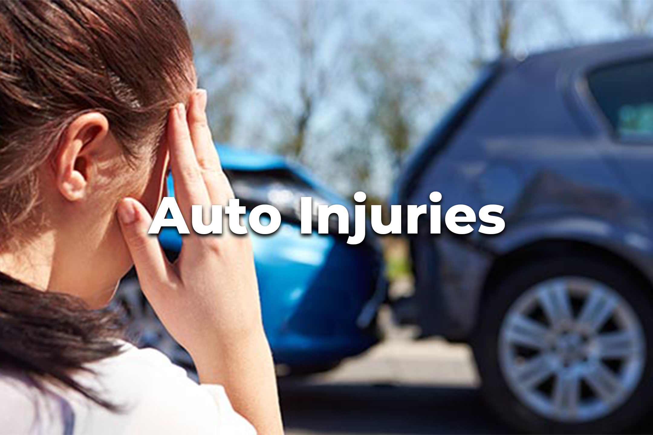 woman holding her head from an auto injury