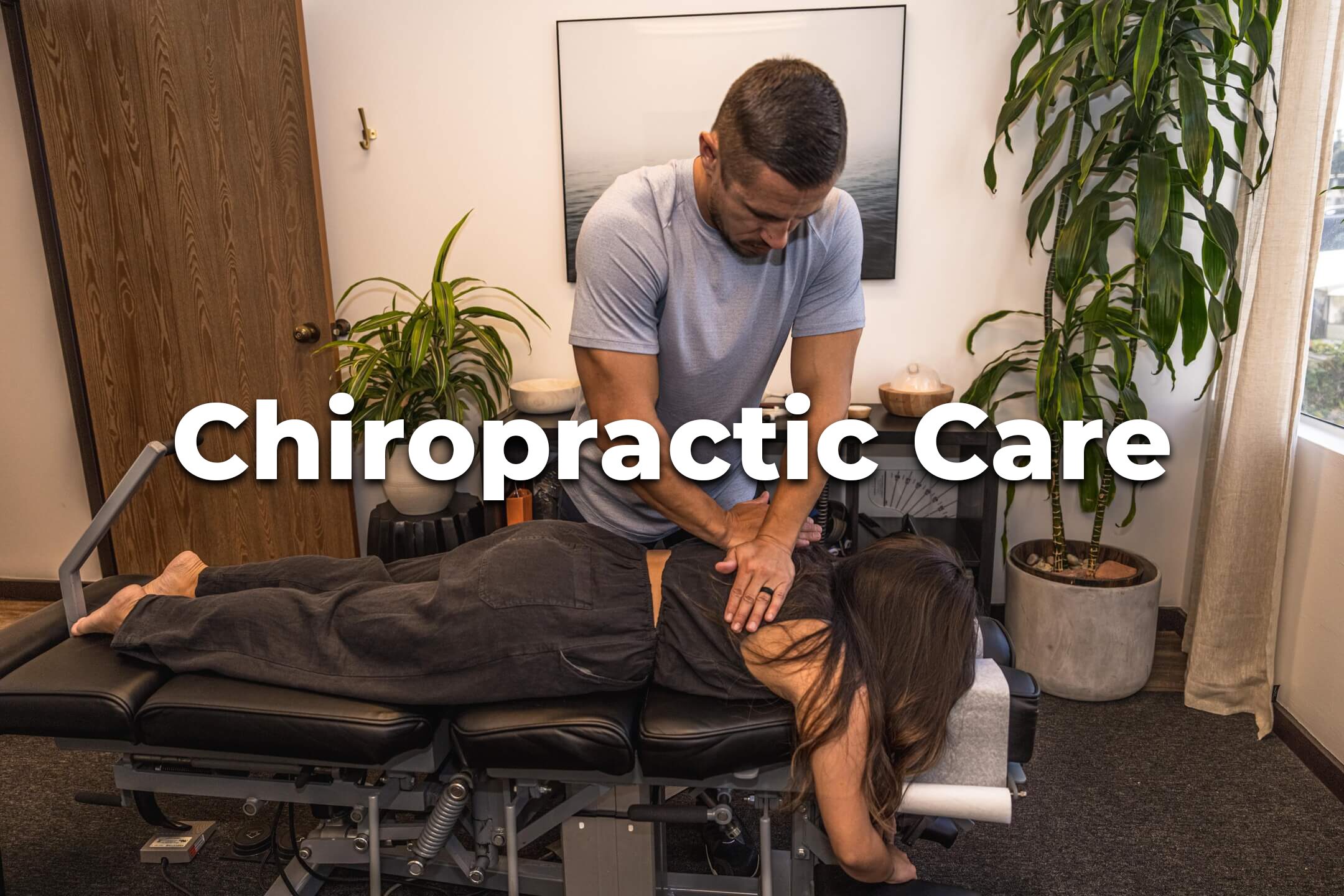 chiropractor adjusting a patient on a table
