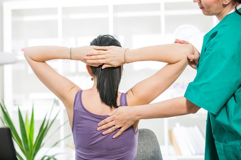 woman getting a back adjustment