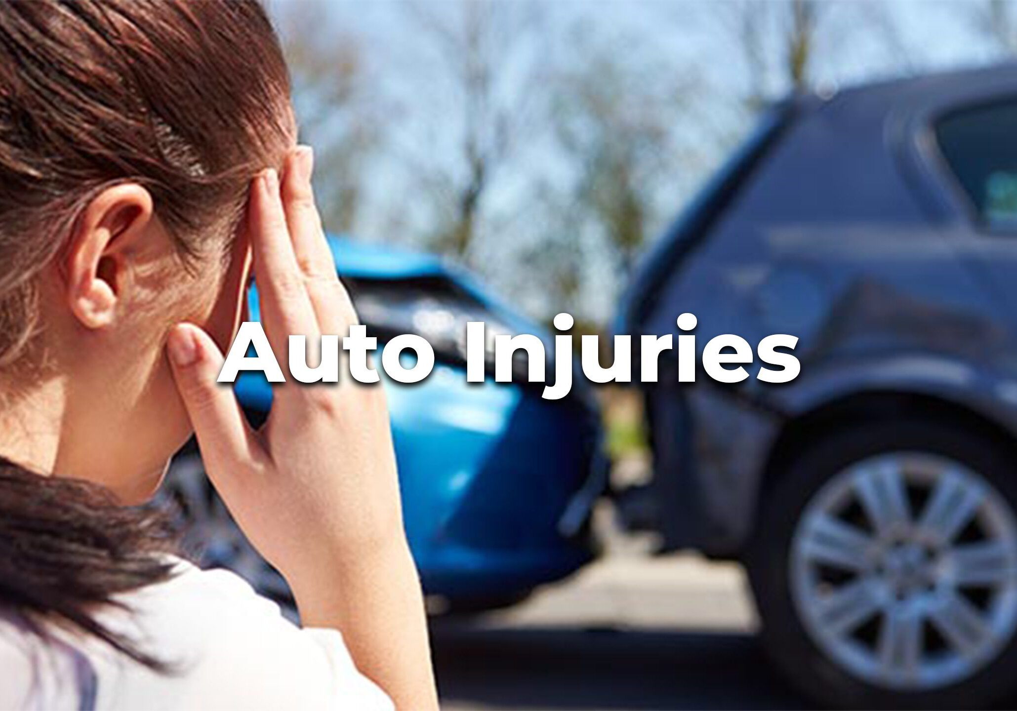 woman holding her head from an auto injury