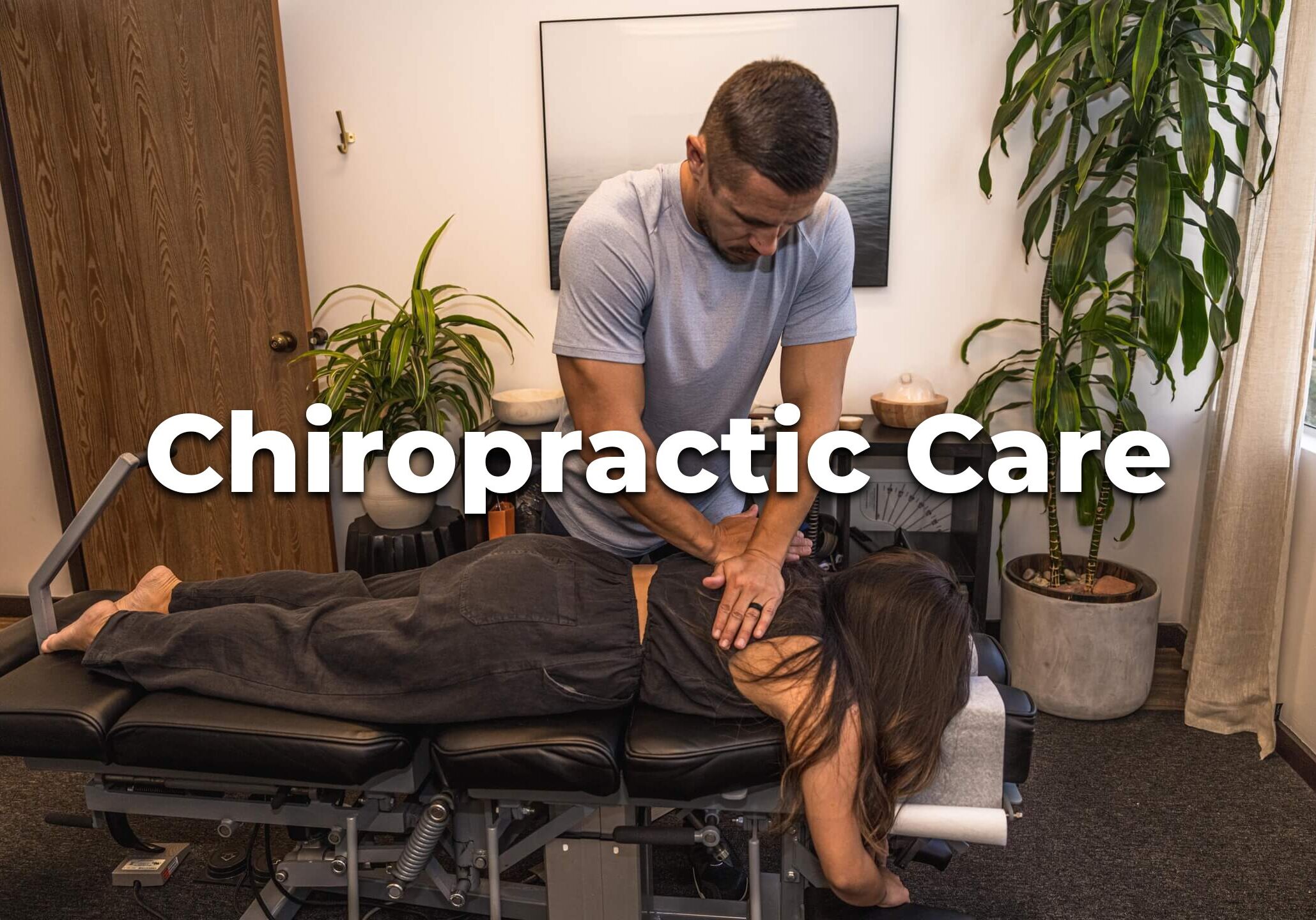 chiropractor adjusting a patient on a table